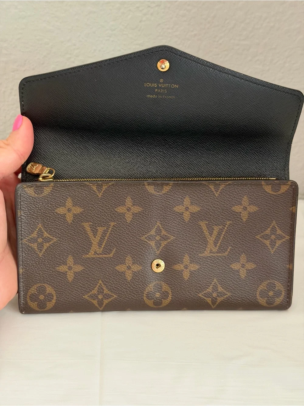 Louis Vuitton Sarah wallet in reverse monogram